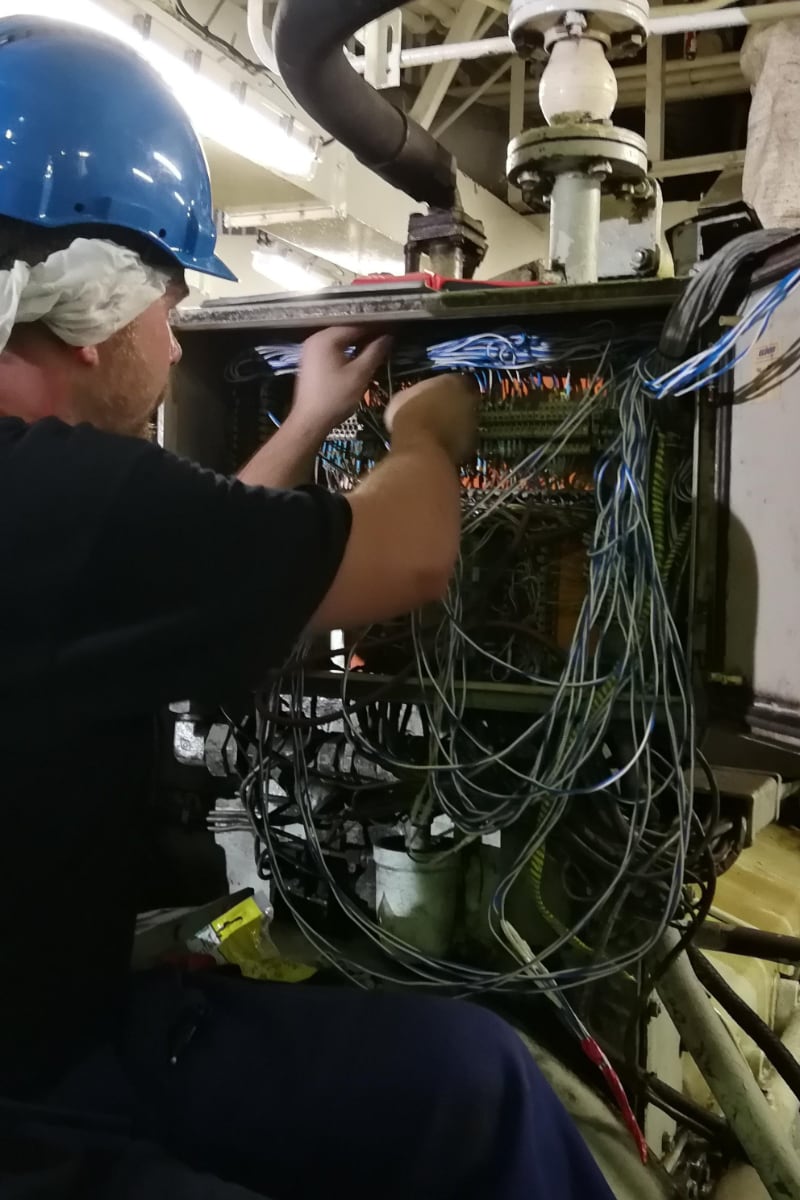 The electrician servicing the switching station